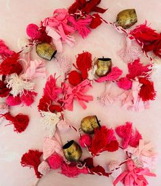 several red and pink flowers on a white surface