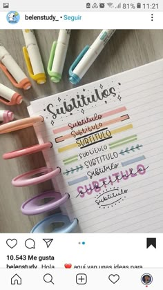 a notepad with writing on it next to some markers and pens in the background