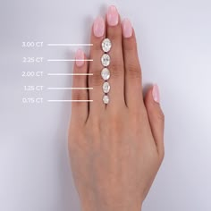 a woman's hand with three diamond rings on her finger and the measurements for each ring