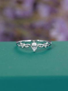 a close up view of a ring on a green box