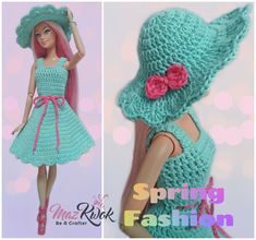 the doll is wearing a green crocheted dress and hat with pink flowers on it