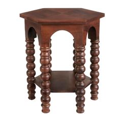 an octagonal wooden table with two legs and a shelf on one side that is turned upside down