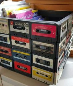 a stack of cassettes sitting on top of a table