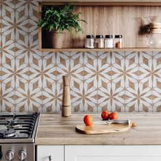 the kitchen counter is clean and ready to be used as a cutting board, with tomatoes on it