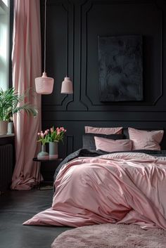 a bedroom with black walls, pink bedding and two planters on the floor