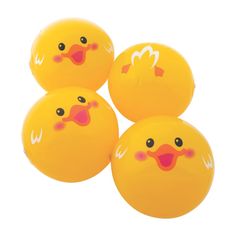 four yellow balloons with faces on them are arranged in the shape of three ducks and one is smiling