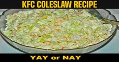 a glass bowl filled with coleslaw on top of a table