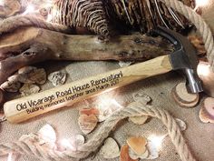 a hammer and some wood are on the ground next to other woodworking items that have been carved into them