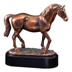 a bronze statue of a horse on a black base