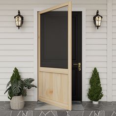 an open door on the side of a house with potted plants next to it