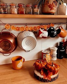 a kitchen counter with pots and pans on it