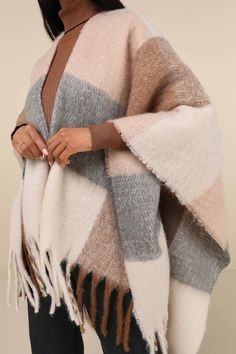 Heading out on a chilly day, but not feeling the coat? Then grab the Coziest Babe Ivory and Brown Plaid Wrap! Soft and fuzzy knit boasts a large-scale plaid design in a variety of chic neutral shades, shaping this wrap-style scarf that has a comfy, oversized design and long fringes at the edges. Measures 96" Wide And 31" Long. 100% Polyester. Hand Wash Cold. Do Not Bleach. Do Not Tumble Dry. Do Not Dry Clean. Imported. Lulus | Coziest Babe Ivory and Brown Plaid Wrap | 100% Polyester. Minimalist Classic Style, Style Scarf, Long Fringes, Neutral Shades, Wrap Scarf, Brown Plaid, Plaid Design, Winter Fashion Outfits, Scarf Styles