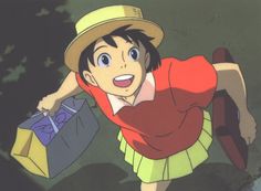 a young man in a red shirt and yellow skirt holding shopping bags while wearing a hat