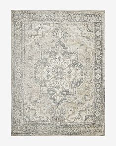 an area rug with grey and white colors