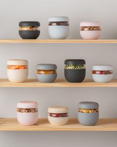 the shelves are filled with various bowls and containers on them, all in different colors