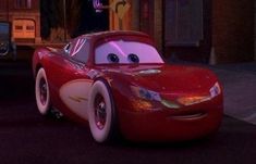 the cars from disney's cars movie are driving down the street