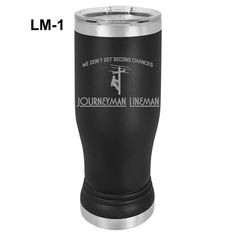 a black and silver tumbler with the words journeyman lineman on it