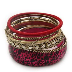 Antique Gold Metal & Magenta Animal Print Wood Bangle Set of 7 - 18cm Length Enjoy high class style with this metal/ wood bangle set. The set featuring: 5 textured bangles crafted in antique gold metal decorated with different pattern and clear crystals, 1 - covered with red-coloured silk thread, and the last one made of wood and decorated with animal print and magenta paint. Diameter of each bangle is approx 6.5cm. One size only. Will fit up to 18cm wrists. Wear them as a set or stacked with other bangles for a rich, glamorous style. Murzana offers a great selection of fashion and costume jewellery: affordable everyday necklaces, chokers, bracelets, bangles, armlets, rings, earrings, brooches, hair jewellery and other accessories. We invite you to check our whole range and decide on your Magenta Paint, Everyday Necklaces, Hair Jewellery, Glamorous Style, Everyday Necklace, Clear Crystals, Bangle Set, Silk Thread