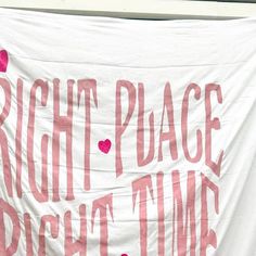 a banner that says right place right time with hearts on it and the words right place right time