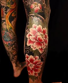 a person with tattoos on their legs and leg