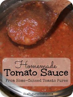 homemade tomato sauce from home - canned tomato puree in a pot with a wooden spoon