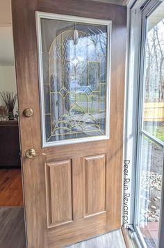 a wooden door with glass on it