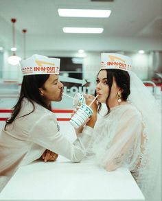 two people dressed as nurses drinking water