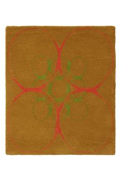 a brown rug with green and red designs on it