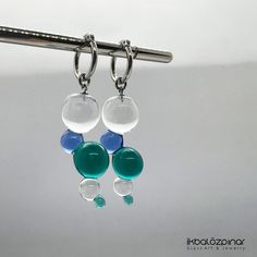 Murano glass handmade earrings. They are unique and they were produced in limited edition only by me. Each piece is handmade in the lampworking techique, which gives it a unique character, therefore each piece can be a little bit different. The hoops are high quality stainless steel. They will never tarnish, it is resistant to bumps and scratches. Diameter of the hoops are 1.5 cm. Including the hoop, the earrings are about 5.5 cm long. Modern Glass Teardrop Earrings, Glass Drop Earrings As Gift, Modern Glass Earrings For Gifts, Modern Handmade Glass Earrings, Modern Nickel-free Glass Earrings, Modern Clear Dangle Earrings, Modern Round Glass Earrings, Modern Green Glass Earrings, Modern Glass Earrings With Ear Wire