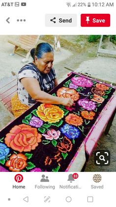 an image of a woman sitting at a table with flowers on it and the caption reads, home following notifict saved