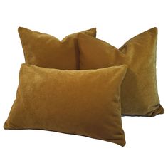 two brown pillows sitting next to each other