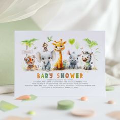 a baby shower card with an image of animals and giraffes on it