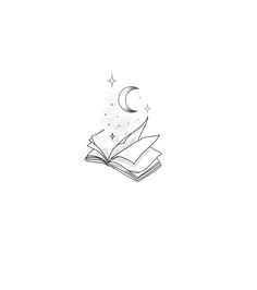 an open book sitting on top of a table next to a star and crescent moon