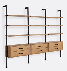 the shelves are made out of wood and have black metal brackets on them, along with drawers