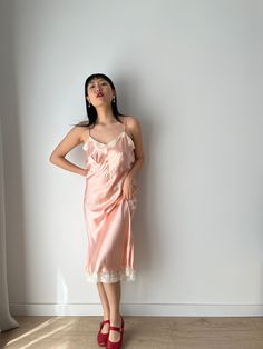 Vintage retro 1950s embroidered camisole slip dress in the softest pastel pink color material: pure silk satin Size: around S,M, Model wears size S, 36, 166cm, 54kg pit to pit: 43 cm waist:36cm Full length 112 cm condition: good antique condition Please keep in mind that this is almost 100 years old. It may have small marks and/or snags and sign of wear throughout. Please purchase willing to accept all signs of wear. --IMPORTANT NOTE--- PLEASE PROVIDE CONTACT NUMBER UPON CHECKOUT For shop update Feminine Silk Slip Dress For Daywear, Feminine Ruffled Slip Dress, Feminine Ruffled Slip Dress For Daywear, Feminine Ruffled Slip Dress For Day Out, Feminine Satin Nightgown For Summer, Feminine Satin Summer Nightgown, Feminine Silk Nightgown With Spaghetti Straps, Pink Lace Trim Slip Dress For Daywear, Pink Satin Camisole For Summer