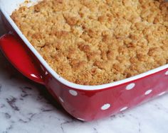 a casserole dish with crumbs in it on a table