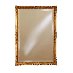 an ornate gold framed mirror against a white background