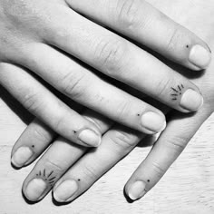 two hands holding each other with small tattoos on their fingers and the words i love you written on them