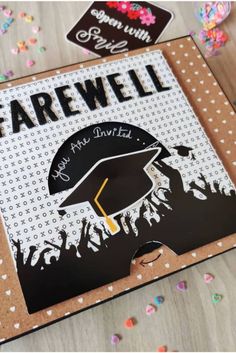 a card with the words farewell and a graduation cap on it, surrounded by confetti