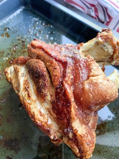 a piece of meat sitting on top of a pan