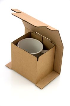 an open cardboard box with two bowls inside