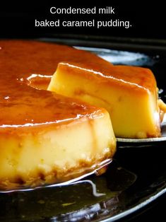 two pieces of cheesecake sitting on top of a pan covered in caramel sauce