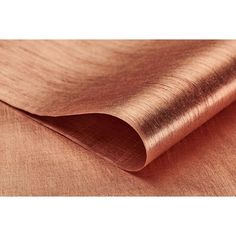 a close up view of copper colored fabric