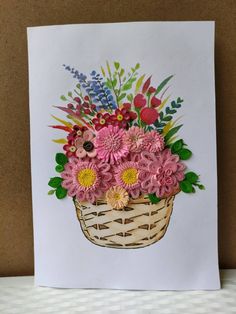 a greeting card with flowers in a basket