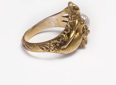 Art Nouveau Gold Mermaid Fresh Water Pearl Ring.Nowadays, rings come in a variety of interesting designs and high-quality materials, some of which are adorned with precious and semiprecious stones. And when it comes to the vintage and antique ones, you definitely have many exquisite models to explore. Please view our collection of rings. Antique Vintage Rings Gold Mermaid, Art Nouveau Ring, Mermaid Ring, Freshwater Pearl Ring, Wax Carving, Mermaid Jewelry, Art Nouveau Jewelry, Pearl Ring, Artistic Jewelry