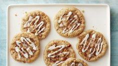 six cookies with icing on a white plate