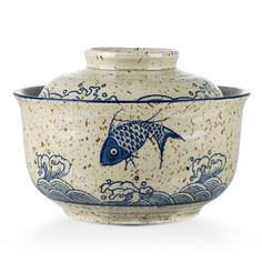 a blue and white bowl with a fish on it