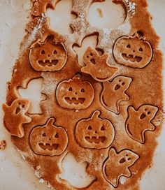 there are many cookies shaped like pumpkins