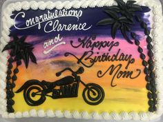 a birthday cake decorated with a motorcycle and palm trees