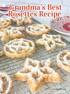 there are many powdered sugar cookies on the cooling rack with words grandma's best rosettes recipe